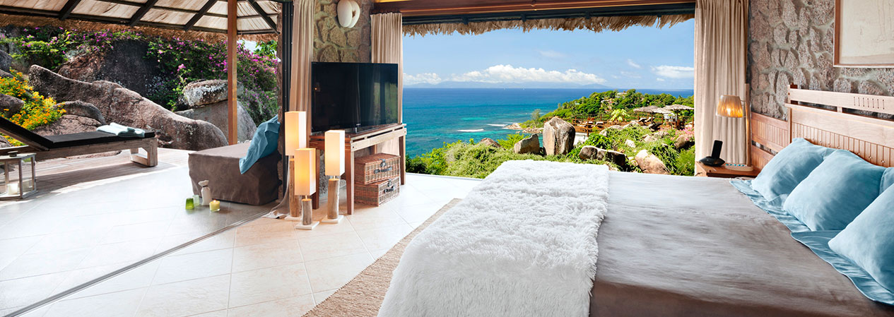 Chambre Junior Suite de luxe avec vue panoramique sur l'océan des Seychelles